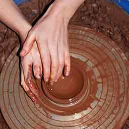 Brid Lyons working at the pottery wheel